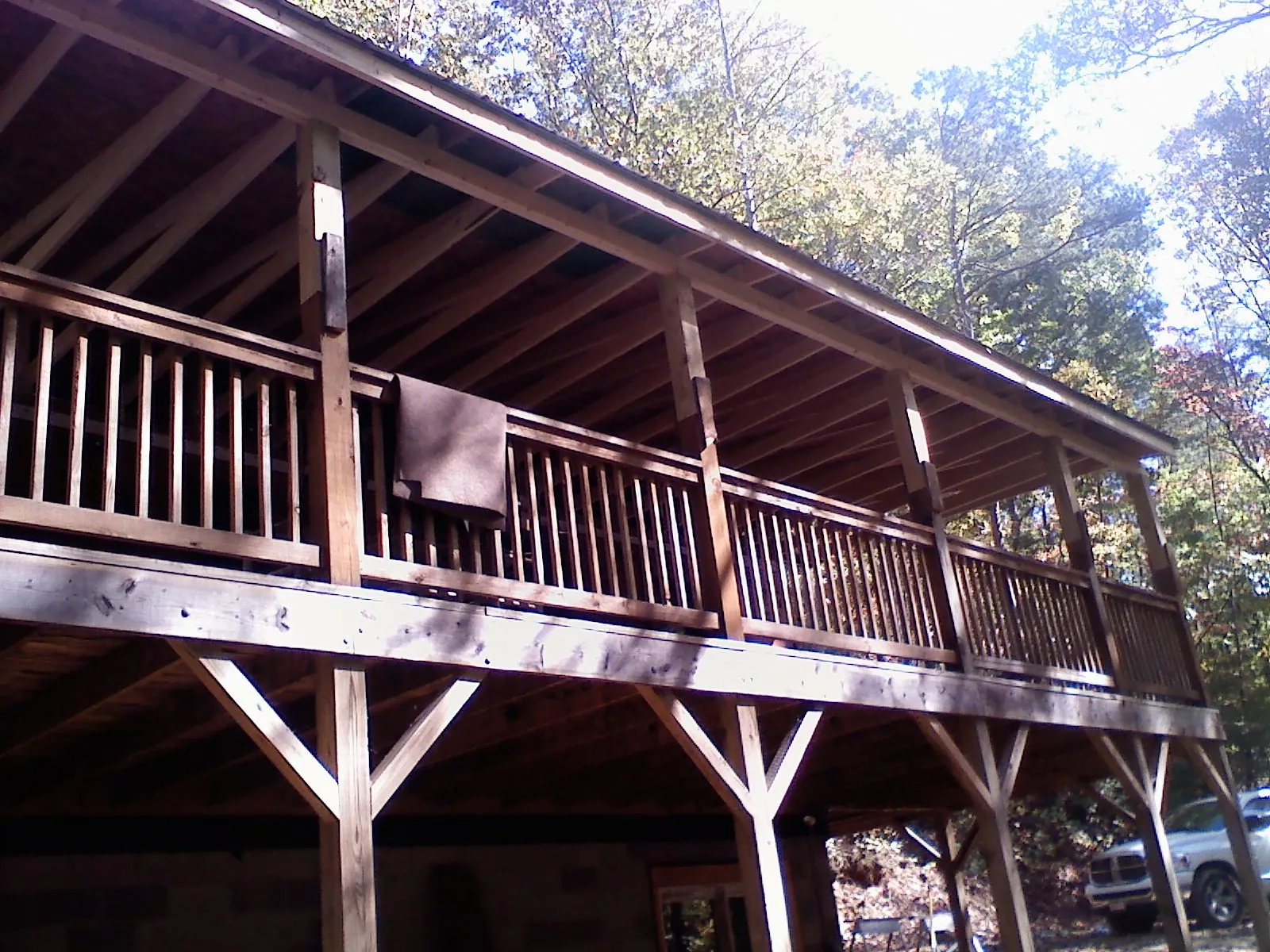 Timber framing under a new elevated porch and deck — Roof Leak Repair in Cazenovia by Roofing Brothers